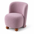 Fauteuil en tissu bouclé rose avec pieds en bois